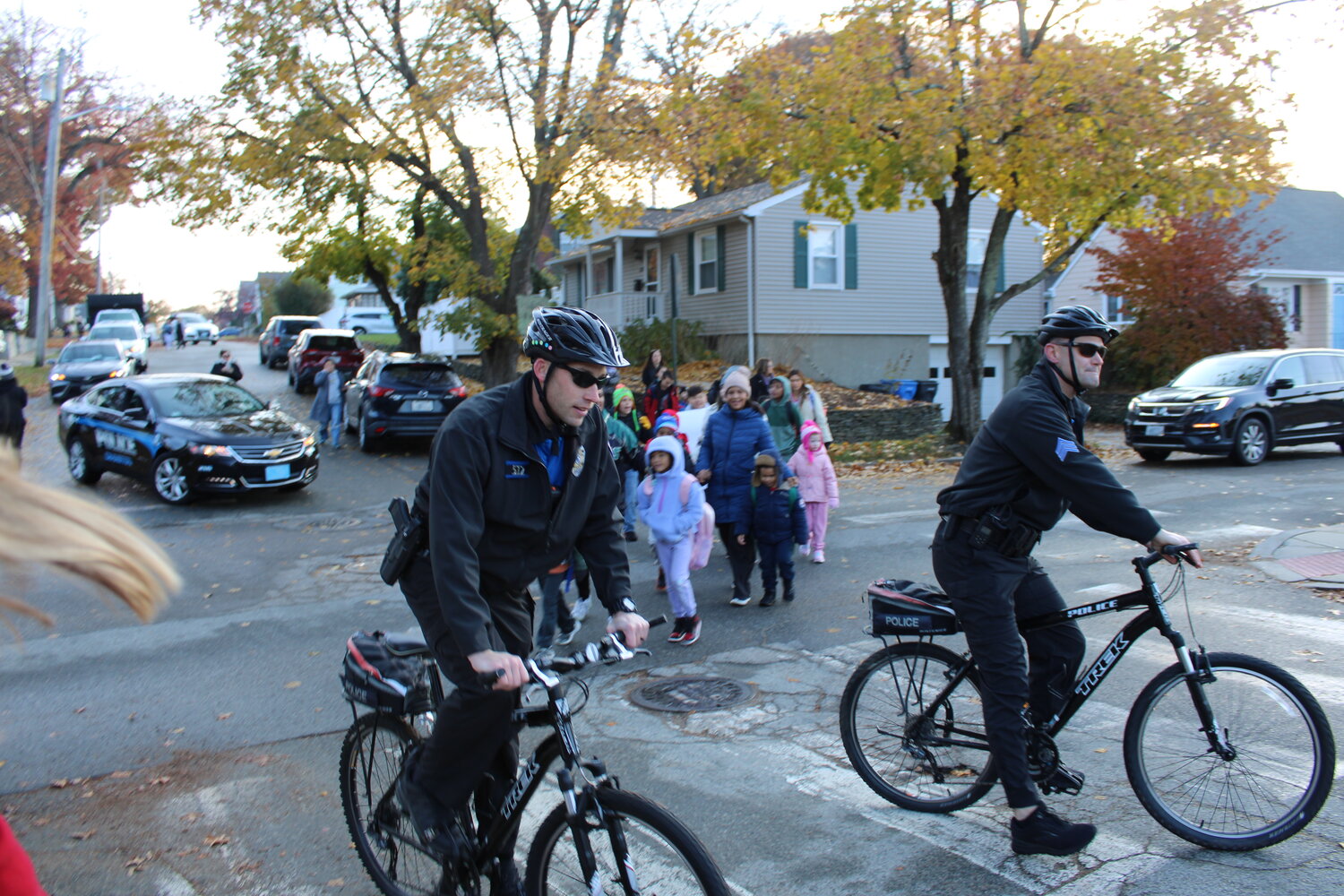 A MORNING BIKE RIDE: Law enforcement accompanied students, parents and teachers on their walk from Dave’s Marketplace down Chestnut Street to the Eden Park Elementary.